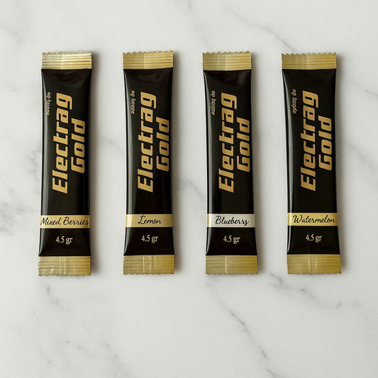 Electrag Gold 4 flavor sachets on white marble background – sugar-free electrolyte supplement made for Dubai heat