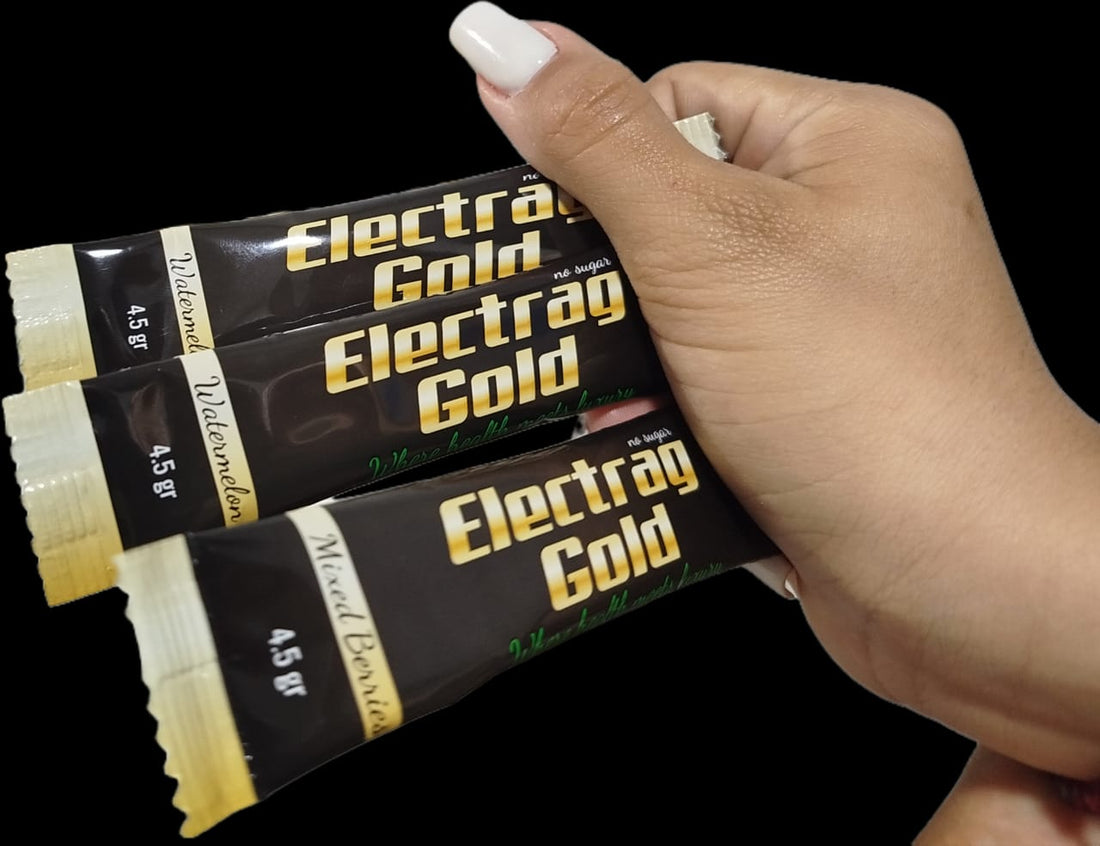 Hand holding three Electrag Gold sugar-free electrolyte sachets for daily hydration in Dubai, UAE – Montaji certified supplement.